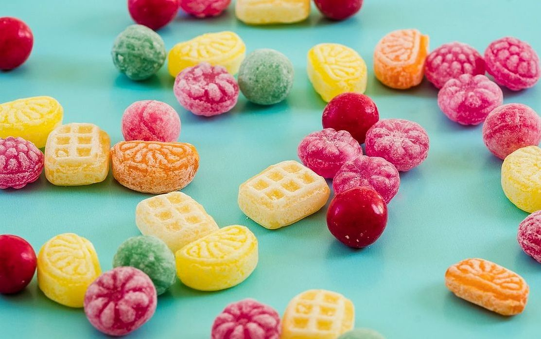 A box of handcrafted chocolate bonbons with a blistered finish